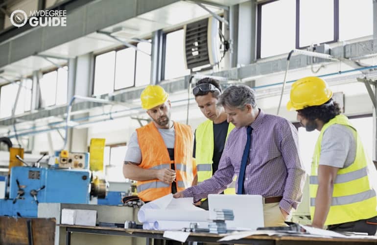 manufacturing supervisor talking to his team