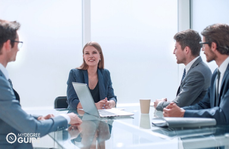 operations manager having a meeting with her team