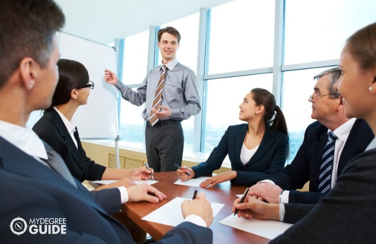 Human Resources Manager presenting his work during an executive meeting