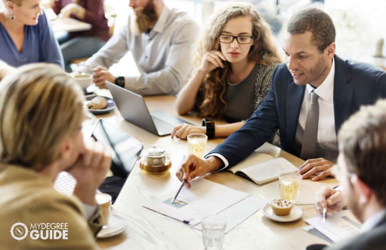 employees discussing a research project