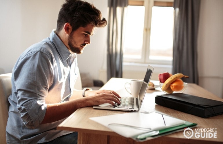 PhD student studying at his home