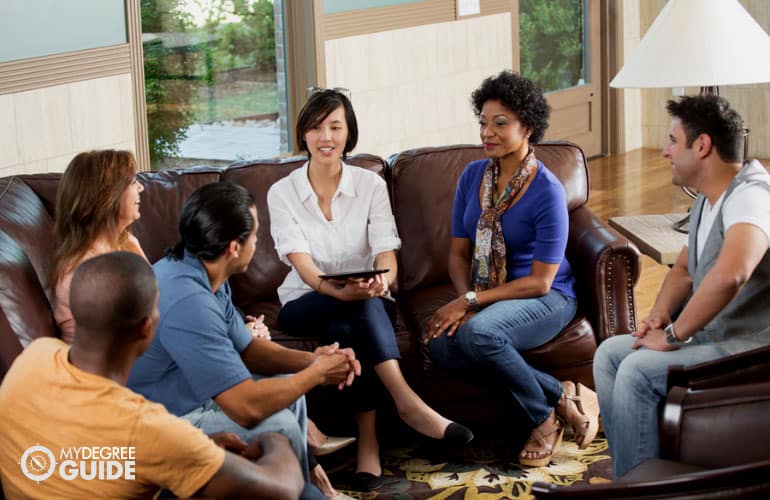 group of people sharing their stories during group counseling session