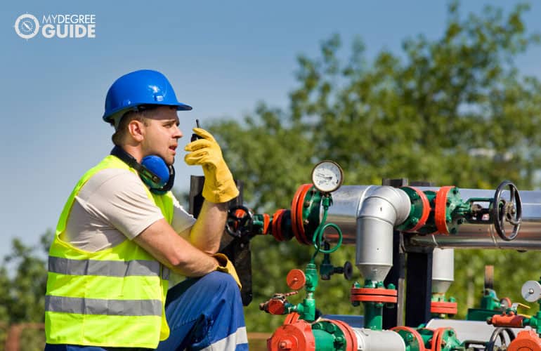 male engineer working in an oil plant