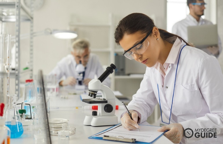 pharmacist checking details of a medicine on computer