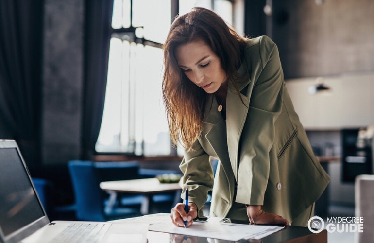 Woman preparing application for Online PhD in Biology