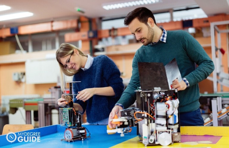 PhD in computer science students testing their project