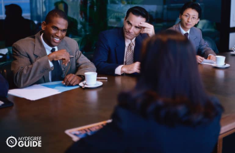 PhD in counseling student talking to interviewers during admissions interview