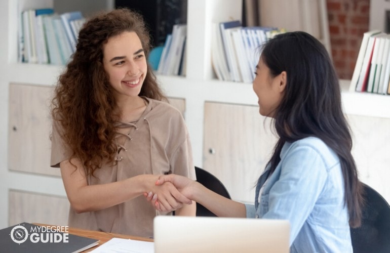 human resource manager talking to her colleague