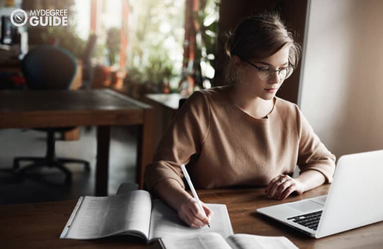 female student studying in a cafe