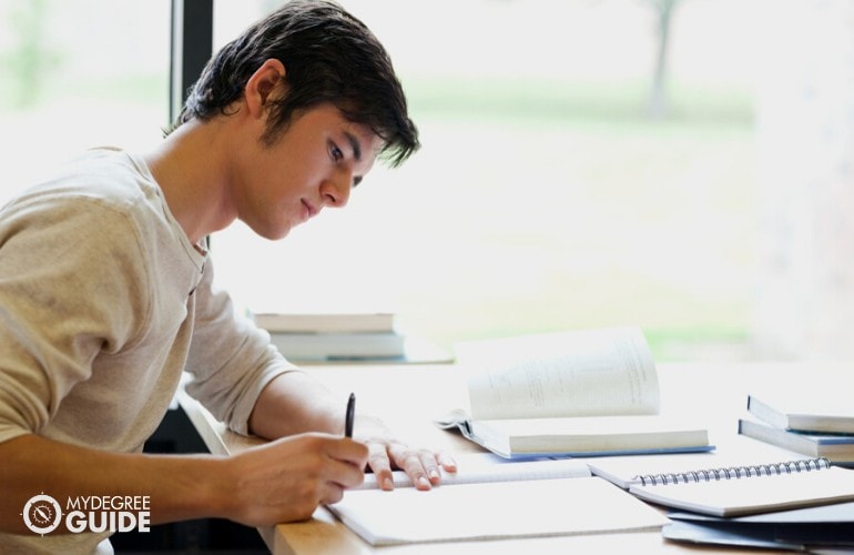 psychology student studying in a library