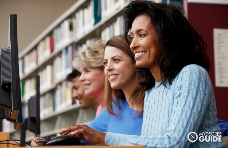 PhD in Psychology students studying in the library