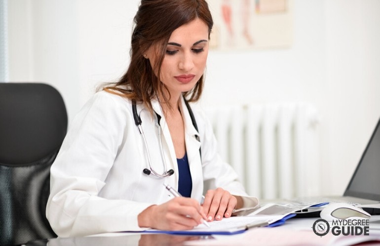 doctor of public health working in her office