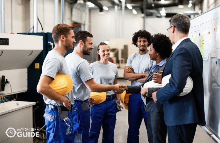 Industrial Production Managers meeting with workers