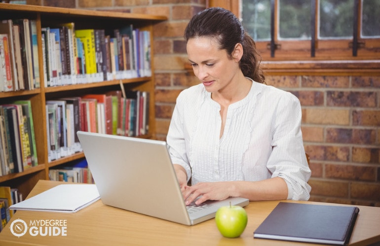 librarian working on her laptop