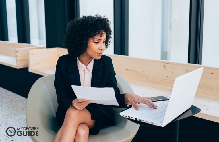 policy analyst working on her laptop