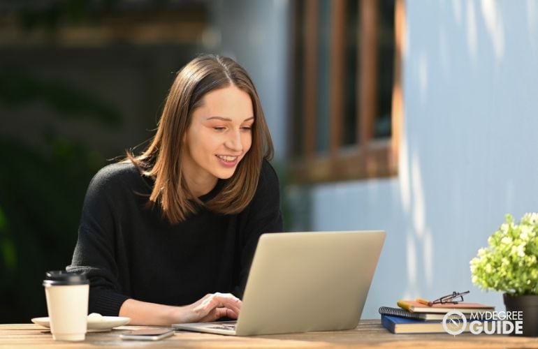 Woman attending Pre Pharmacy Online program