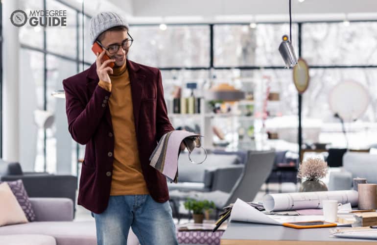 male procurement specialist talking to customer on the phone