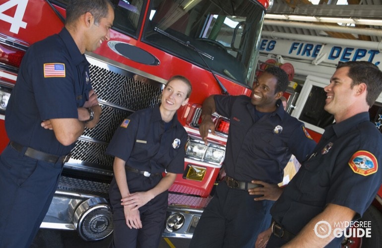 firefighters happily chatting with each other