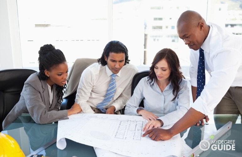 project manager briefing his colleagues about a project