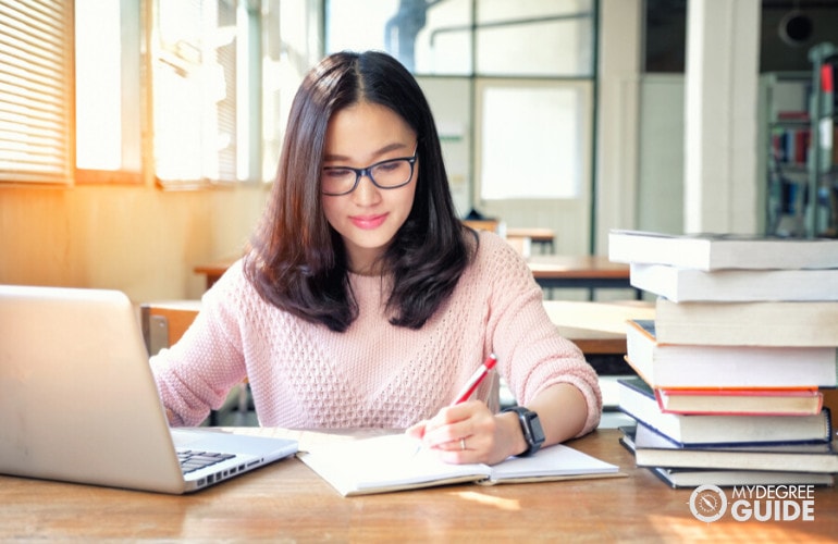 Project Management student studying in library