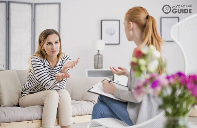 female psychologist talking to a patient in the office