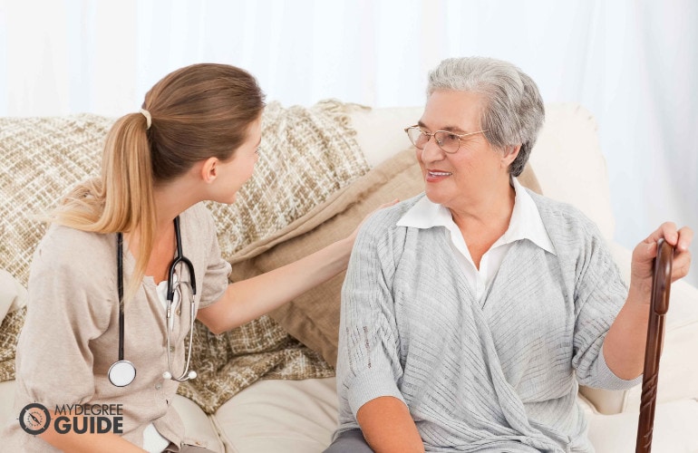 community health worker with an old woman