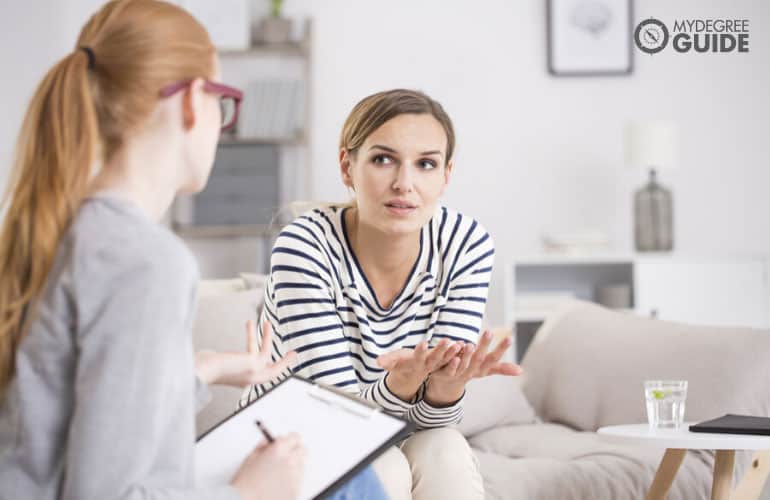 psychologist talking to a patient in her office