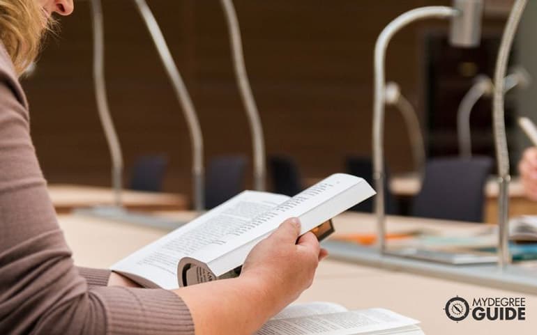 psychology graduate student reading a book