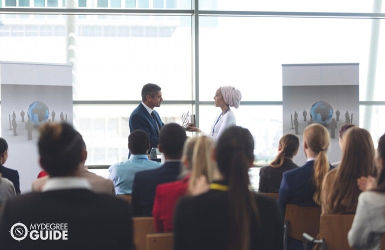 psychologist receiving a certificate