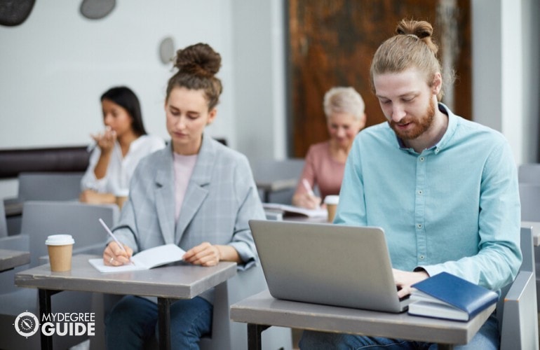 doctor of psychology students studying in a classroom