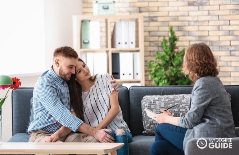 psychiatrist talking to a couple during consultation