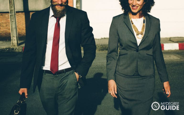 Two public administrators walking