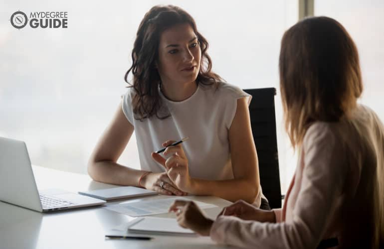 human resource manager talking to a colleague 