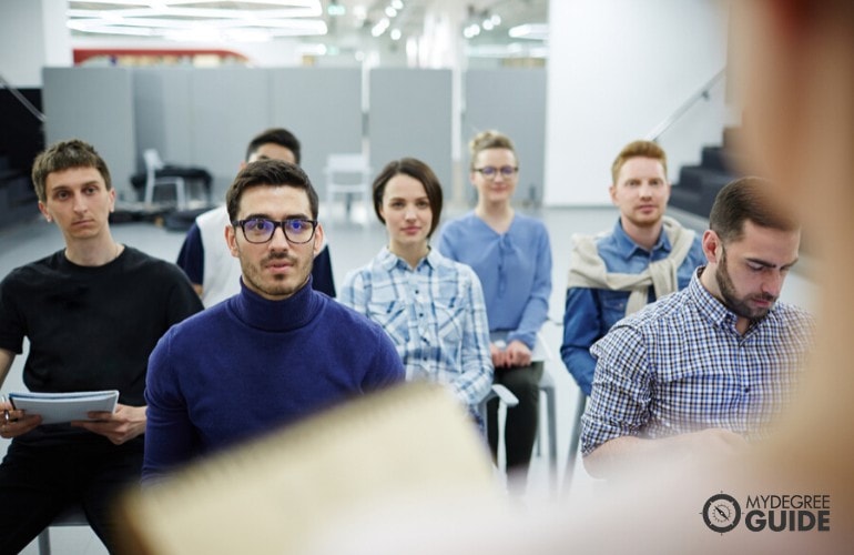 Public Administration students listening to their professor in class