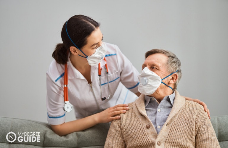 doctor and her assistant checking on a patient