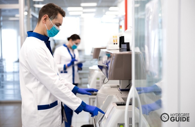 Epidemiologists working in laboratory