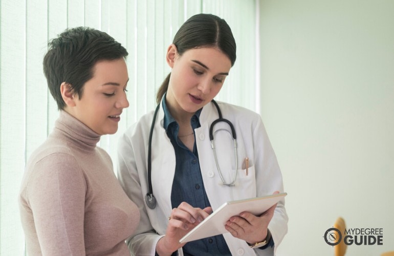 public health consultant talking to a patient