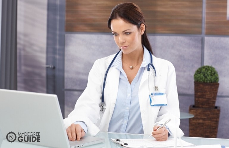 public health worker working on her laptop