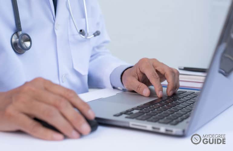 public health worker working on a laptop computer