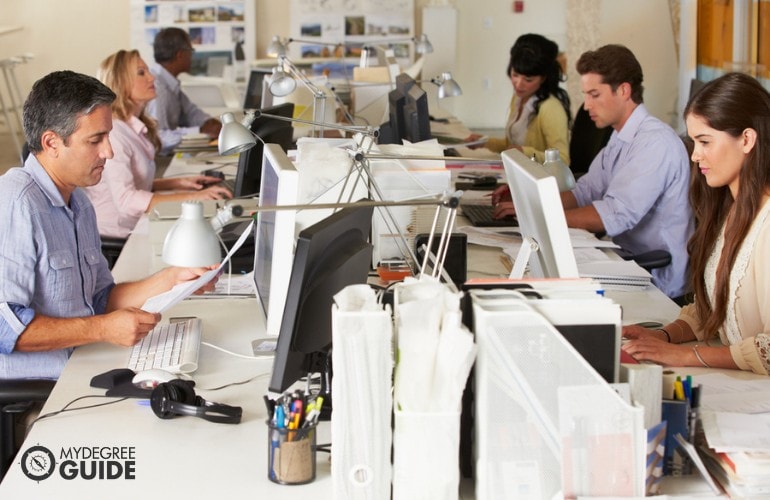 Market Research Analysts working in the office