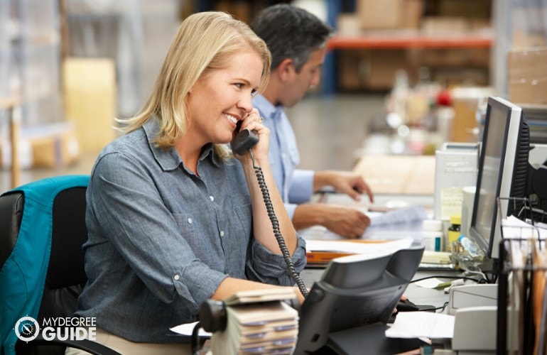 purchasing agent talking to supplier on the phone