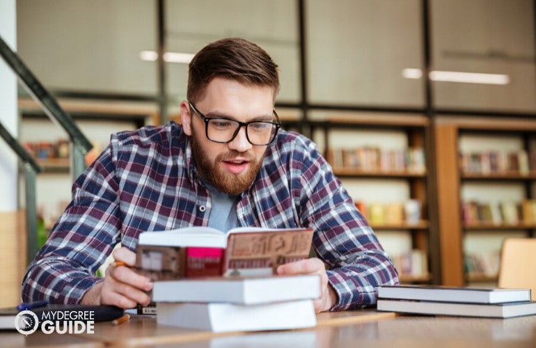 Adult Bachelor Degree student reading a book