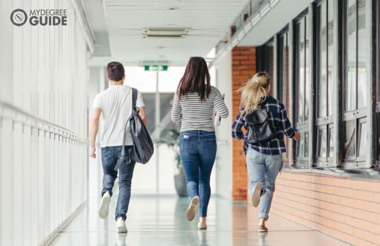 students running around university campus