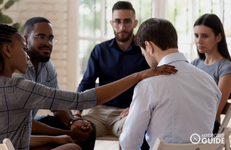 Rehabilitation Counselor talking to patients during group counselling 