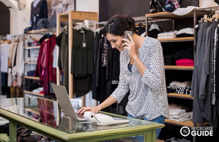 store manager talking to a client on the phone