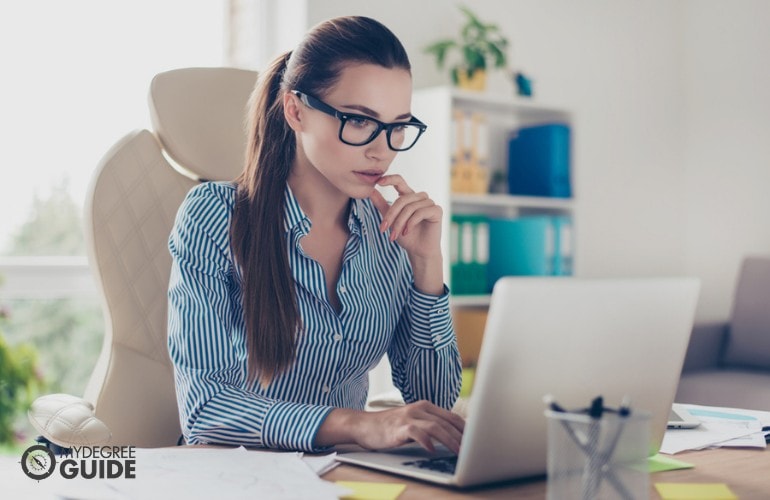 Policy Analyst working in her office