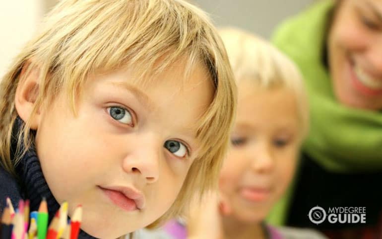 school speech pathologist teaching students