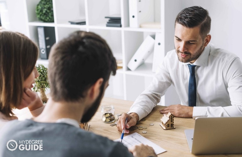 insurance agent talking to a couple