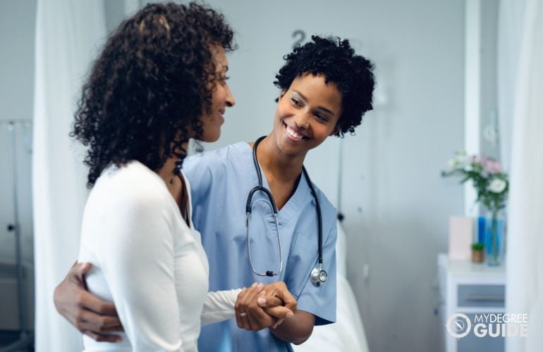 Medical Assistant guiding a patient