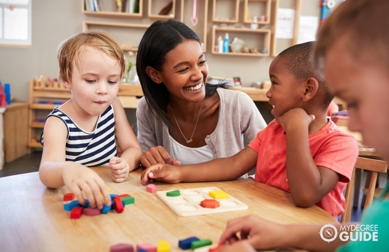 preschool teacher with students